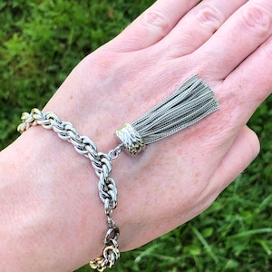 Vintage silver tone bracelet with tassle