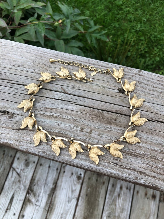 Signed Monet gold tone tulip necklace