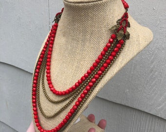Signed Hobe vintage festoon necklace with red faceted beads and brass box chains, leaf details on sides