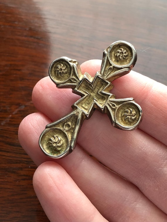 Hefty cross pendant marked Metropolitan Museum of Art.