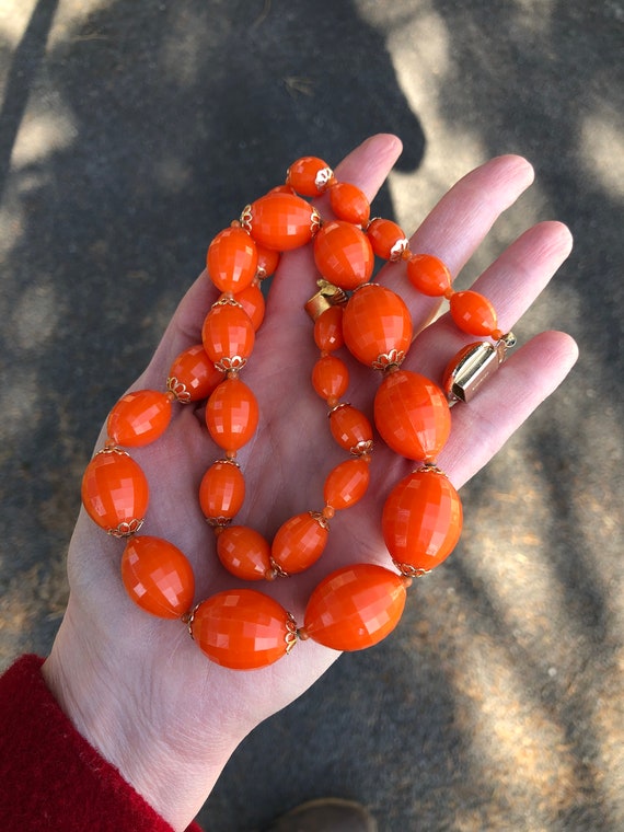 Orange acrylic beaded necklace marked Hong Kong, v