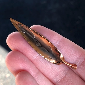 Signed Stuart Nye copper leaf pin