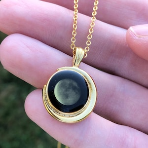 Beautiful moon pendant on gold tone chain