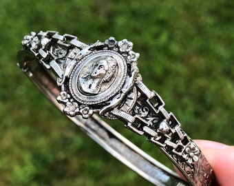 Costume jewelry Victorian style clamper bracelet with small cameo