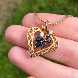 Sapphire and CZ heart pendant on gold tone chain signed Avon