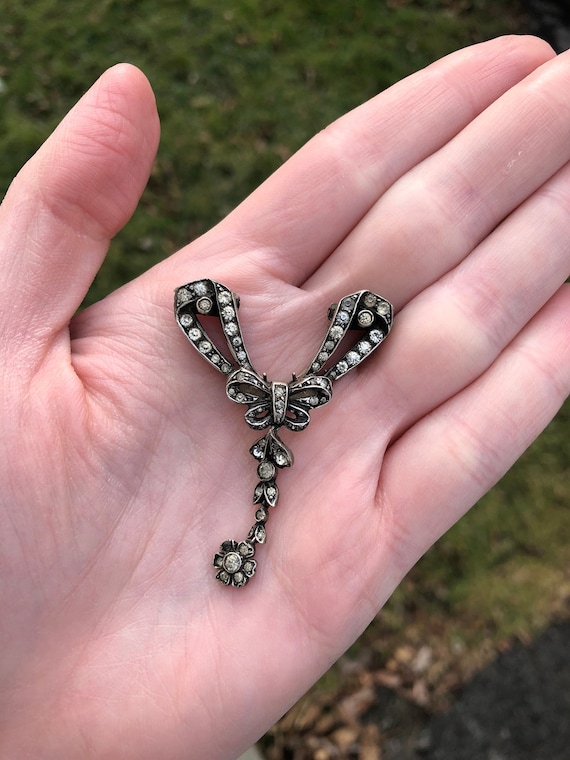 Antique paste sterling silver bow and flower drop