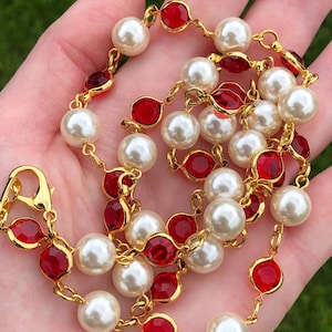 Lightweight acrylic red open back rhinestone and faux pearl necklace