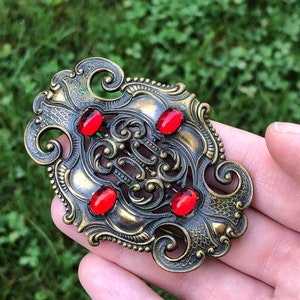 Gorgeous early 20th century sash pin with bright red cabochons!