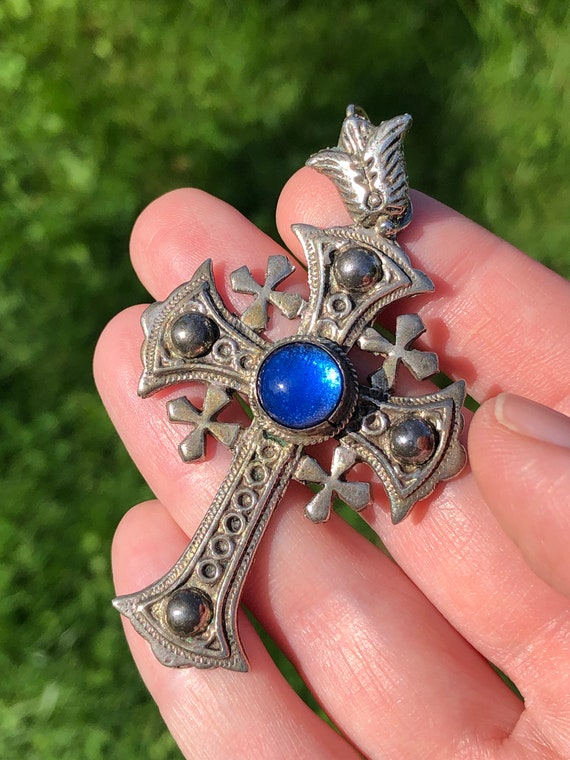 Gothic style cross pendant with bright blue caboch