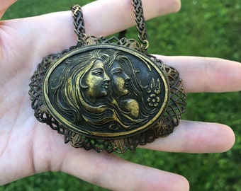 Vintage double cameo necklace in brass, huge!