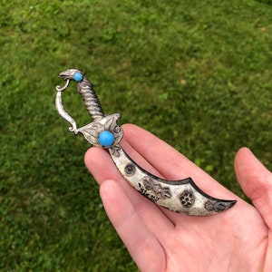 Very large Coro sword brooch with eagle handle, some missing rhinestones, sold as-is!