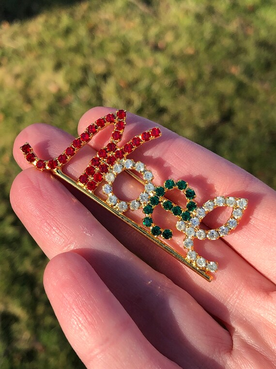 Vintage Noel Christmas brooch with red and green r