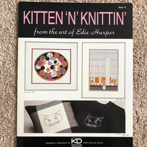 May include: A softcover instructional booklet titled KITTEN 'N' KNITTIN' from the art of Edie Harper, Book 1E. The cover features illustrations of cats, yarn balls, and needlework designs, with the KD ARTISTRY logo at the bottom center.