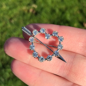 Signed Krementz sparkly heart and arrow brooch, silver tone