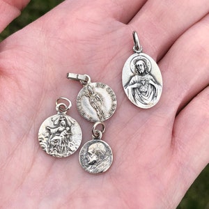 Lot of 4 miscellaneous small saint medals