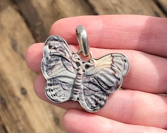 Large carved stone butterfly pendant in sterling bezel, artist signed