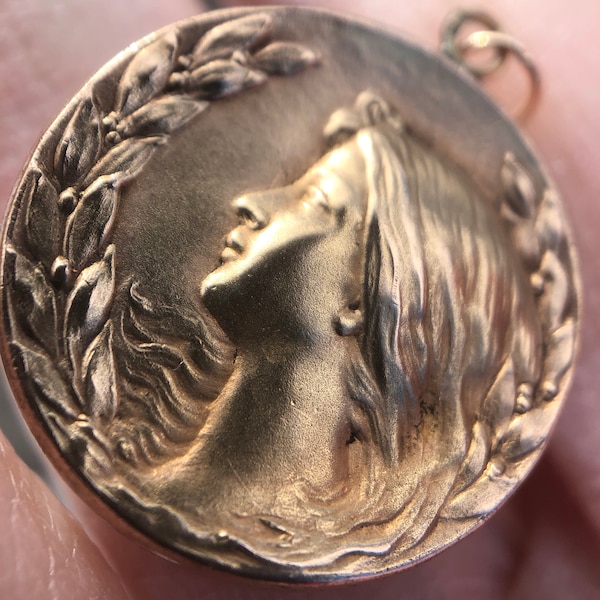 Petite antique art nouveau pendant, lady with flowing hair and leaves and berries, former locket soldered shut