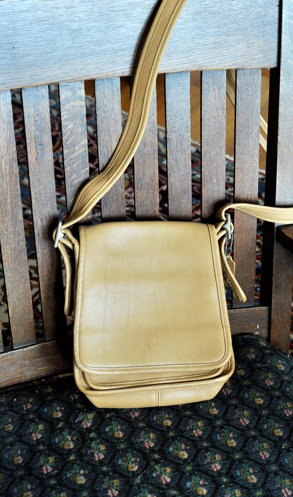 light yellow coach purse
