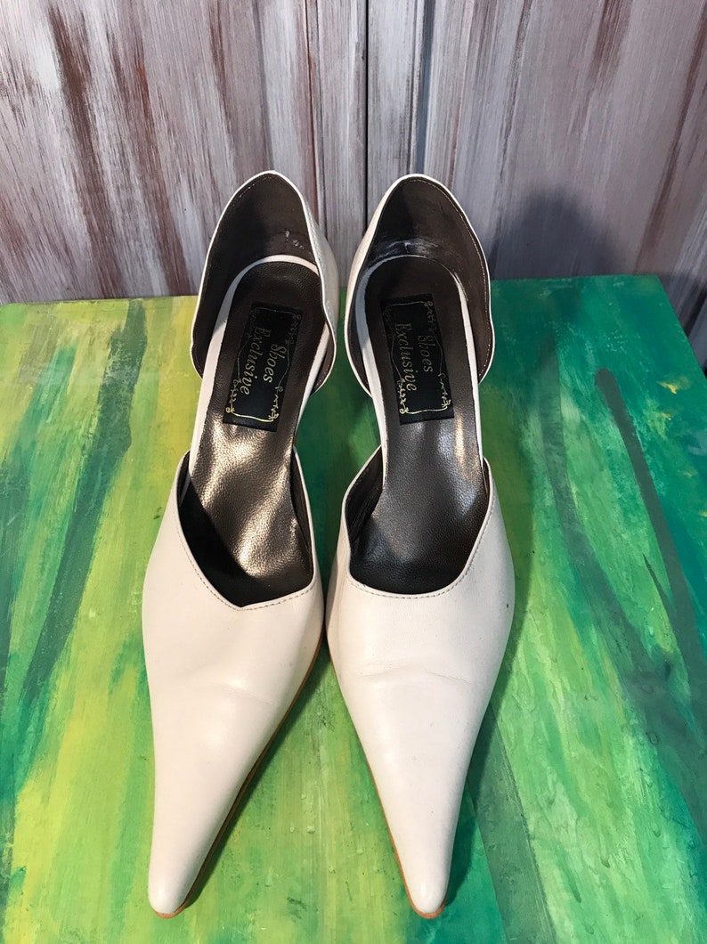 white pointed shoes