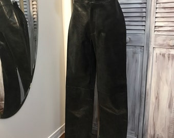 Very high waisted vintage women's leather pants in black leather snake look - size 8 waist circumference 29 inches - legs 34