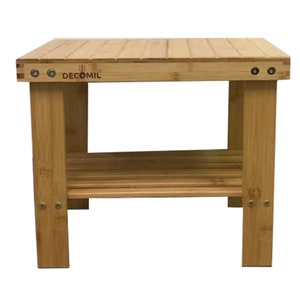 May include: A natural bamboo shoe rack with two shelves. The rack has a brown stain and is labeled "DECOMIL".