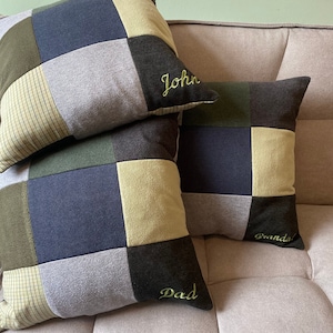 May include: Three square patchwork cushions in green, blue, and grey. Each cushion features an embroidered name: "John", "Dad", and "Granda!". The cushions are arranged on a neutral-toned sofa, offering a cosy, handcrafted aesthetic.
