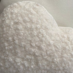 Handmade boucle cloud cushion close up detail