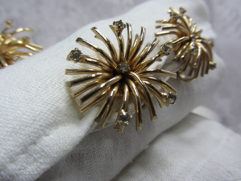 Berg\u00e9re Gold Tone and Clear Rhinestone Burst Brooch and Matching Clip Earrings