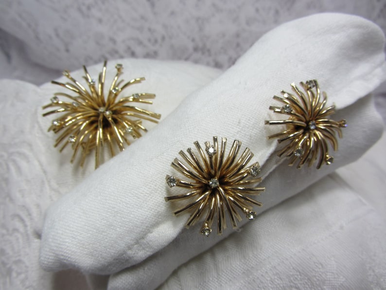 Berg\u00e9re Gold Tone and Clear Rhinestone Burst Brooch and Matching Clip Earrings