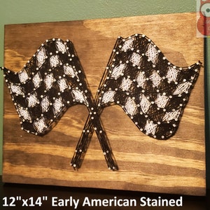 May include: A 12" x 14" wooden sign with a checkered flag design created using string art. The sign is stained in an "Early American" finish.