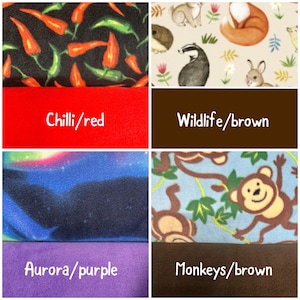May include: A collage of six fabric swatches featuring various patterns and solid colors. Patterns include red and green chili peppers on black, woodland animals on cream, a blue aurora borealis print, and brown monkeys on light blue. Solid colors include red, brown, and purple.