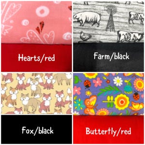 May include: A collage of four fabric swatches: a pink fleece with white hearts and red accents over solid red, a gray farm-themed print with animals and a windmill over solid black, a yellow fox print over solid black, and a floral butterfly print over solid red.