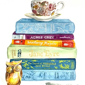 May include: A stack of classic literature books, including "Jane Eyre", "Wuthering Heights", and "Agnes Grey", with a teacup and saucer on top. A small wooden owl figurine sits in front of the books, and a blue feather is on the bottom of the stack.