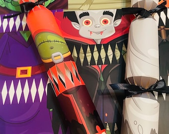 May include: Halloween-themed party crackers with black ribbon ties. The crackers feature monster and ghost designs, with one cracker open, revealing wrapped candies. The background showcases Halloween character illustrations.