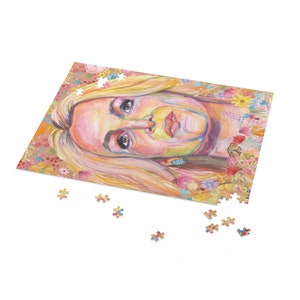 May include: A colourful jigsaw puzzle featuring a portrait of a person with blonde hair and a floral background.