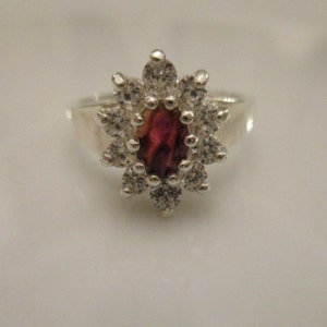 A Ruby and Silver Ring.
