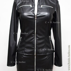May include: A black leather jacket and skirt set with a zipper closure and silver hardware. The jacket has a stand-up collar and long sleeves. The skirt is a mini skirt. The set has the text "C+K Atelier" printed on it.