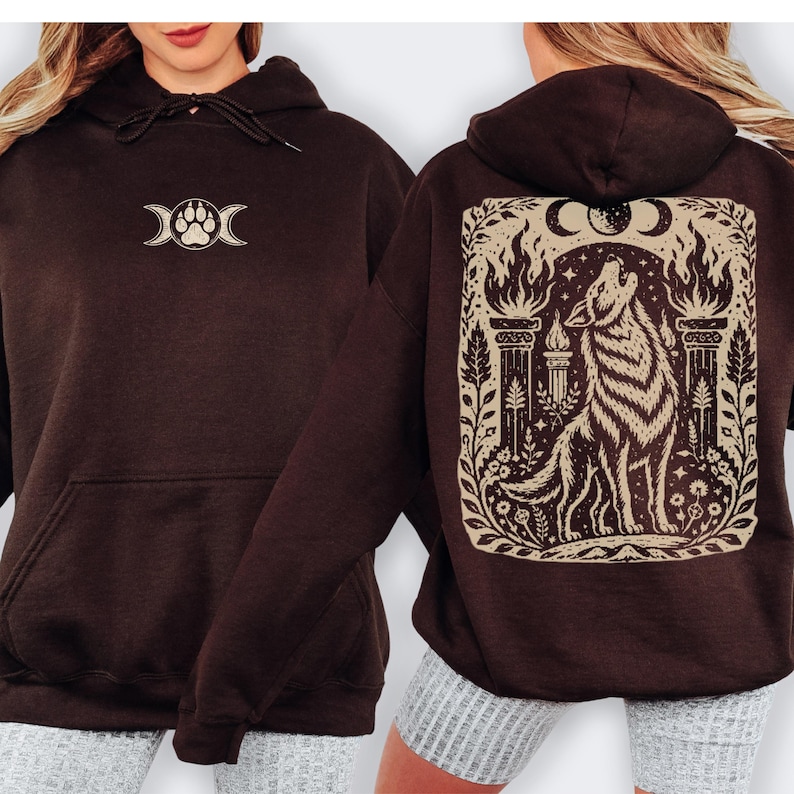 Dark chocolate hoodie with linocut wolf print on back.