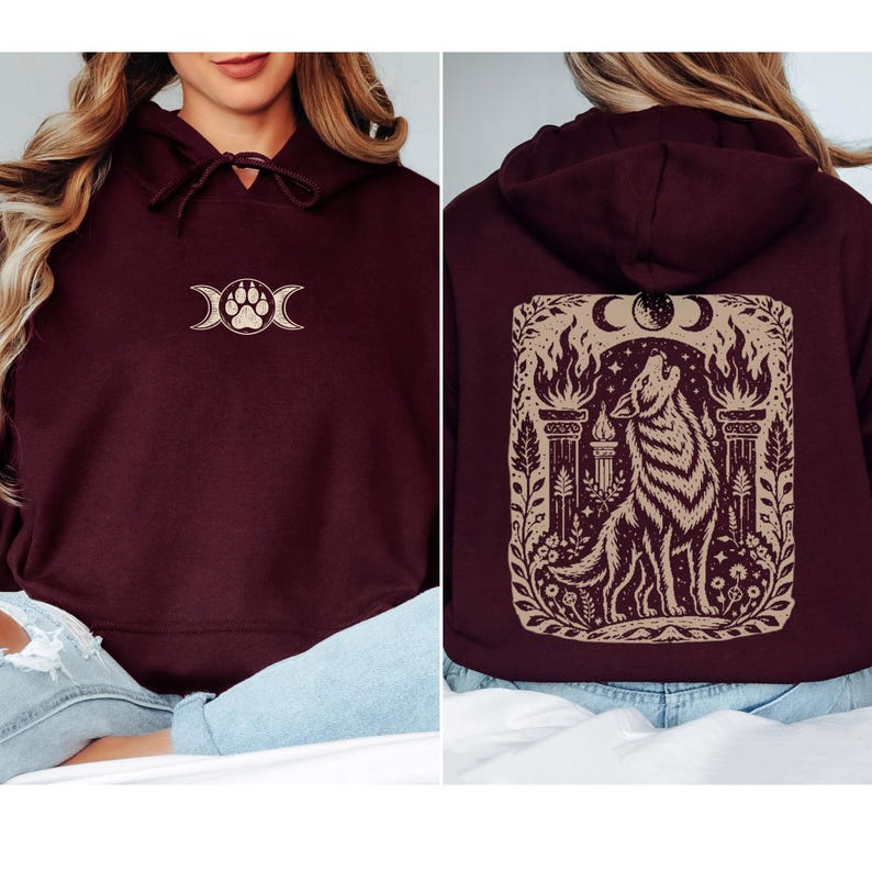 Model wearing maroon hoodie with full back wolf and moon design.