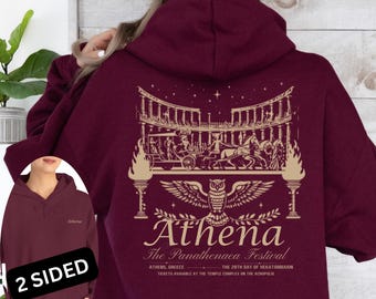 May include: Burgundy hoodie with a graphic on the back featuring an owl, architectural elements, and the text "Athena The Panathenaea Festival". The front of the hoodie has the word "Athena".