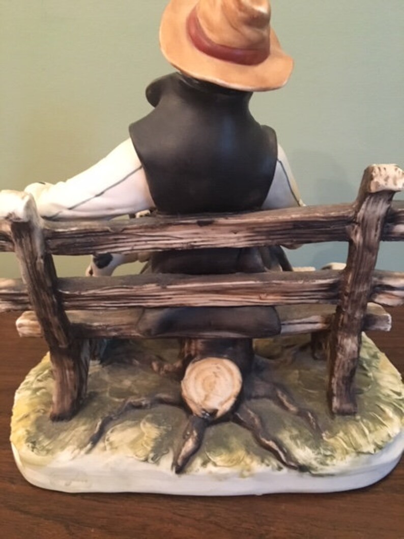 capodimonte tramp on bench with dog