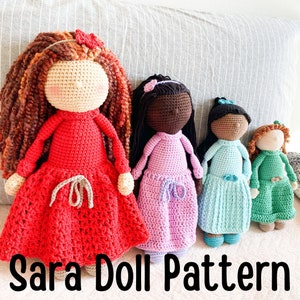 May include: Four handmade crochet dolls in various colors. The dolls have different skin tones, hair colors, and outfits. The dolls are wearing red, pink, blue, and green dresses. The text "Sara Doll Pattern" is at the bottom of the image.