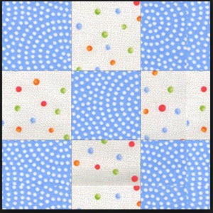 May include: A patchwork quilt square design featuring nine squares. The squares alternate between a light blue polka dot pattern and a cream-colored background with colorful polka dots in red, green, and orange. The design is symmetrical.