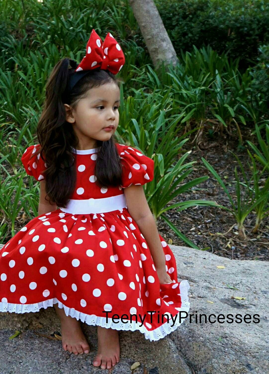 Minnie Mouse. I especially love seeing her in the red and white polka dot  dress and bow! That's what she wore …