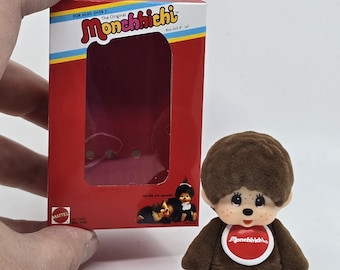 El mono Monchhichi marrón más pequeño del mundo en miniatura con minicaja personalizada. La figura cabe en su interior.