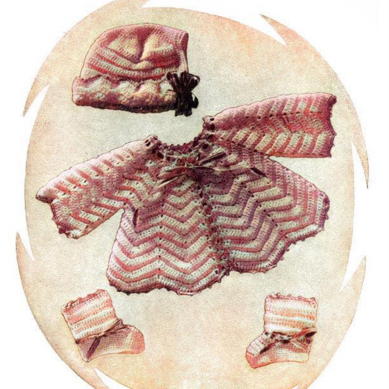 May include: A crocheted baby outfit in pink and white, including a hat, sweater, and booties.