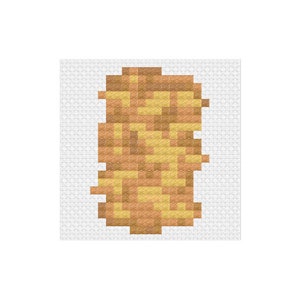 May include: A pixelated image of a brown and yellow object, resembling a piece of bread or a pastry.