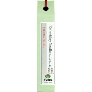May include: A package of Tulip brand embroidery needles. The package is light green with a white label that reads "Embroidery Needles Assorted Sharp Tip" and "Hiroshima Needles." The package includes needle sizes #3, #4, #5, and #6.