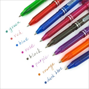 May include: An assortment of colorful gel pens in green, red, blue, rose, black, purple, orange, and dark blue. The pens are arranged diagonally, with the ink colors labeled on the white background. The pens have a transparent barrel.