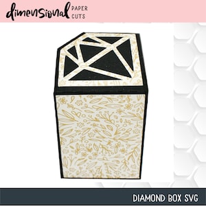 May include: A black diamond-shaped box with a white geometric design on the lid. The sides of the box feature a cream-colored floral pattern with gold accents. The text "Dimensional Paper Cuts" and "DIAMOND BOX SVG" are visible.